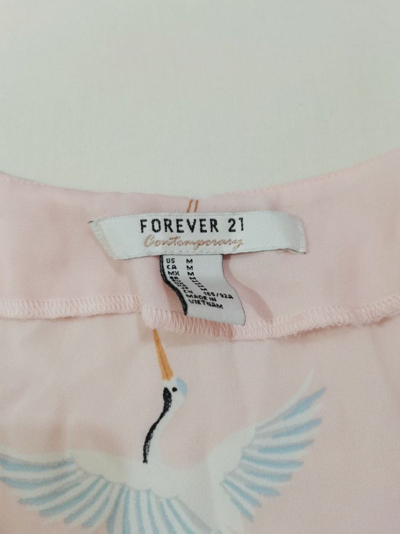 Forever21 Pink Long Sleeves Blouse (Category: Blouses) located in San Jose del Monte. Submitted by declothering_ph (Listing ID 1342765296, Image 2). Description: button on one sleeve is missing very bagsak yung tela!.