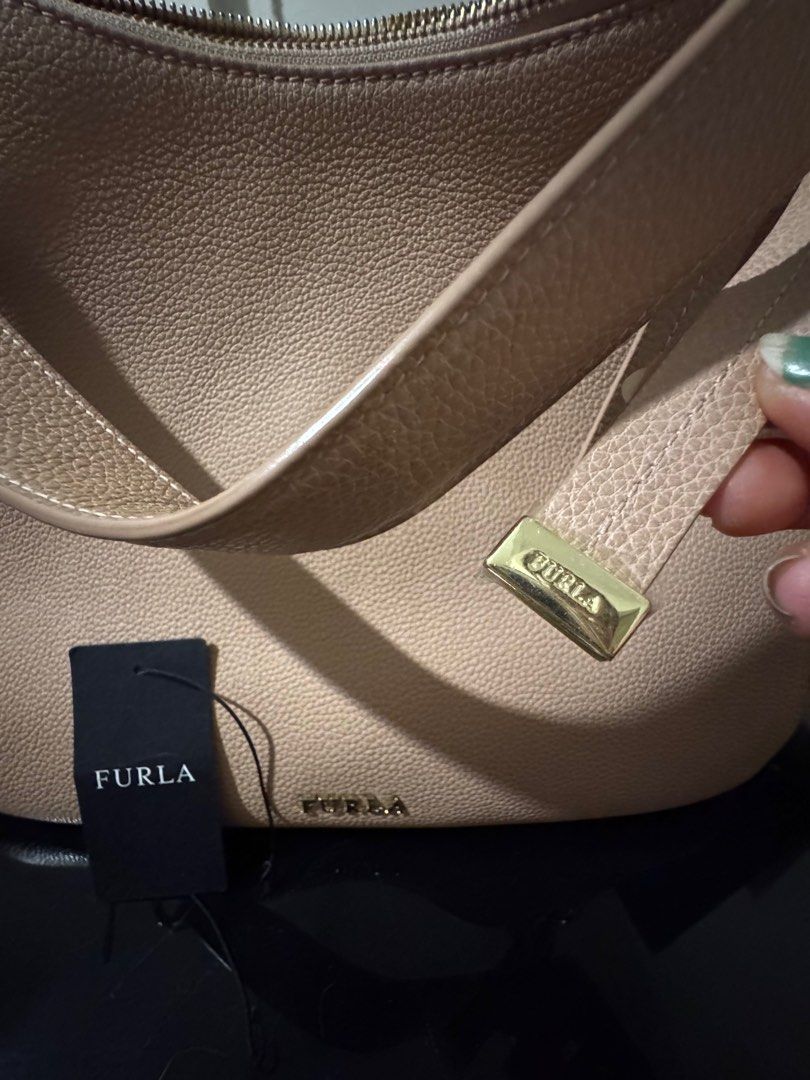 Furla sling and shoulder bag (Category: Cross-body Bags) located in Bacoor. Submitted by efanidem (Listing ID 1342807316, Image 1). Description: Original Furla With care card No paper bag Bought in US With minimal signs of wear.