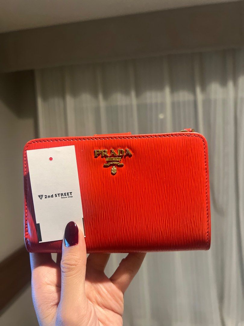 Prada Long Wallet Red 1ML225 (Japan sourced) (Category: Wallets & Card holders) located in Makati City. Submitted by p___ad (Listing ID 1342821748, Image 3). Description: Rank A with very minimal flaw and can pass as bnew Medium sized wallet Bought in Japan (100% authentic) No inclusions .