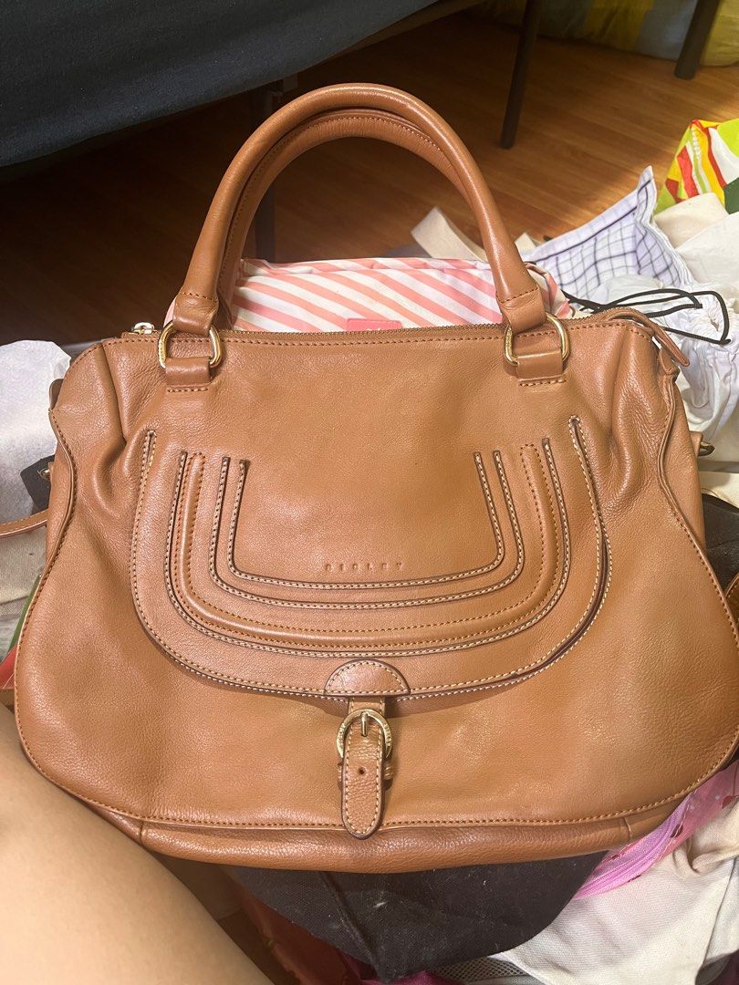SISLEY brown shoulder bag (Category: Shoulder Bags) located in Marikina City. Submitted by declutterisse (Listing ID 1342747519, Image 1). Description: Barely used. Slightly negotiable. Flaw: theres a crack mark on one of the hidden pockets (see photo) but other than that, bag is in great shape..