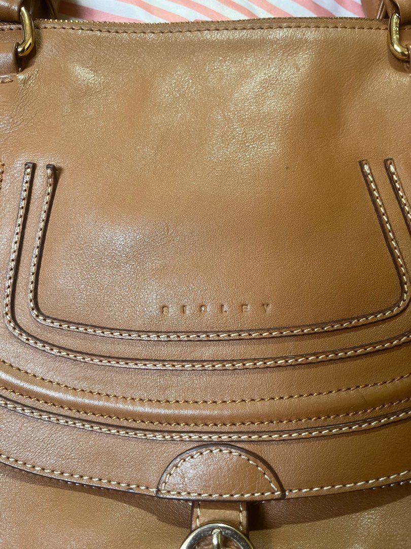 SISLEY brown shoulder bag (Category: Shoulder Bags) located in Marikina City. Submitted by declutterisse (Listing ID 1342747519, Image 2). Description: Barely used. Slightly negotiable. Flaw: theres a crack mark on one of the hidden pockets (see photo) but other than that, bag is in great shape..