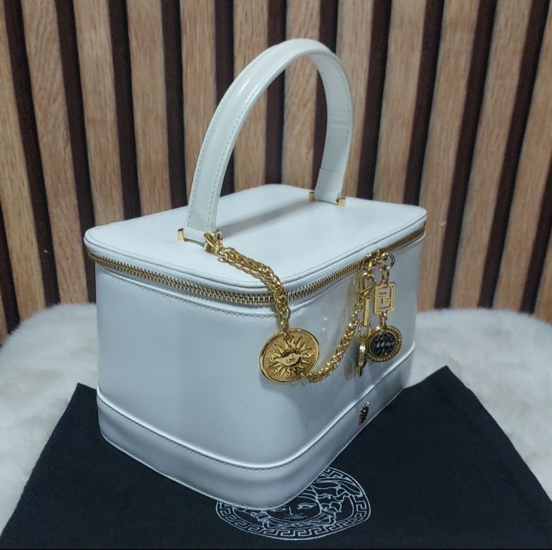 Authentic Rare Versace white Vanity bag (Category: Luxury Bags & Wallets) located in Binangonan. Submitted by makoleksyon (Listing ID 1343024496, Image 2). Description: excellent condition like new no Flaws super gold na gold pa hardware rare hand to find pwede lagyan ng sling bought in Japan 💯% Authentic Money back guaranteed.