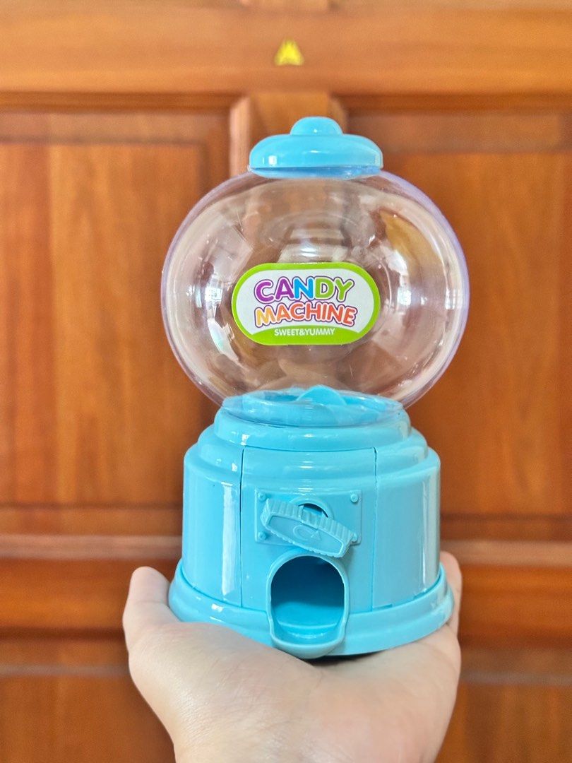 Candy Machine (Category: Kids Toys) located in Singapore. Submitted by peanutbutterjelly88 (Listing ID 1342955304, Image 1). Description: each $7 Size 9cm Width X 9cm Length X 14cm Height.