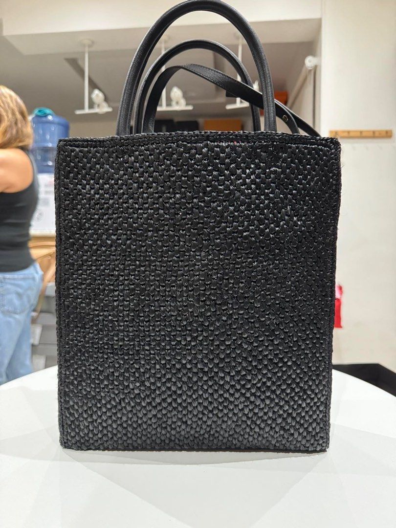 Loewe Black Raffia Tote (Category: Luxury Bags & Wallets) located in Quezon City. Submitted by yujin_1826 (Listing ID 1342960893, Image 2). Description: Brand New/Unused With Paper bag, Dust bag and cards. Unlined woven raffia with leather trims and gold-tone hardware Made in Spain Open top One main compartment Front logo detail Measures approx 28 cm W x 37 cm H x 8 cm D Top handle with a 11 cm drop Detachable and adjustable shoulder strap with a