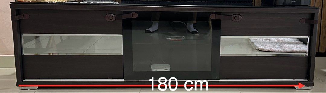 Tv console table solid wood (Category: TV Consoles) located in Kuala Lumpur. Submitted by anandk (Listing ID 1342943339, Image 1). Description: Well maintained tv console table. Comes with thick tempered glass. What u see is what u get. 180x52x48 cm. Price can nego for serious buyers.