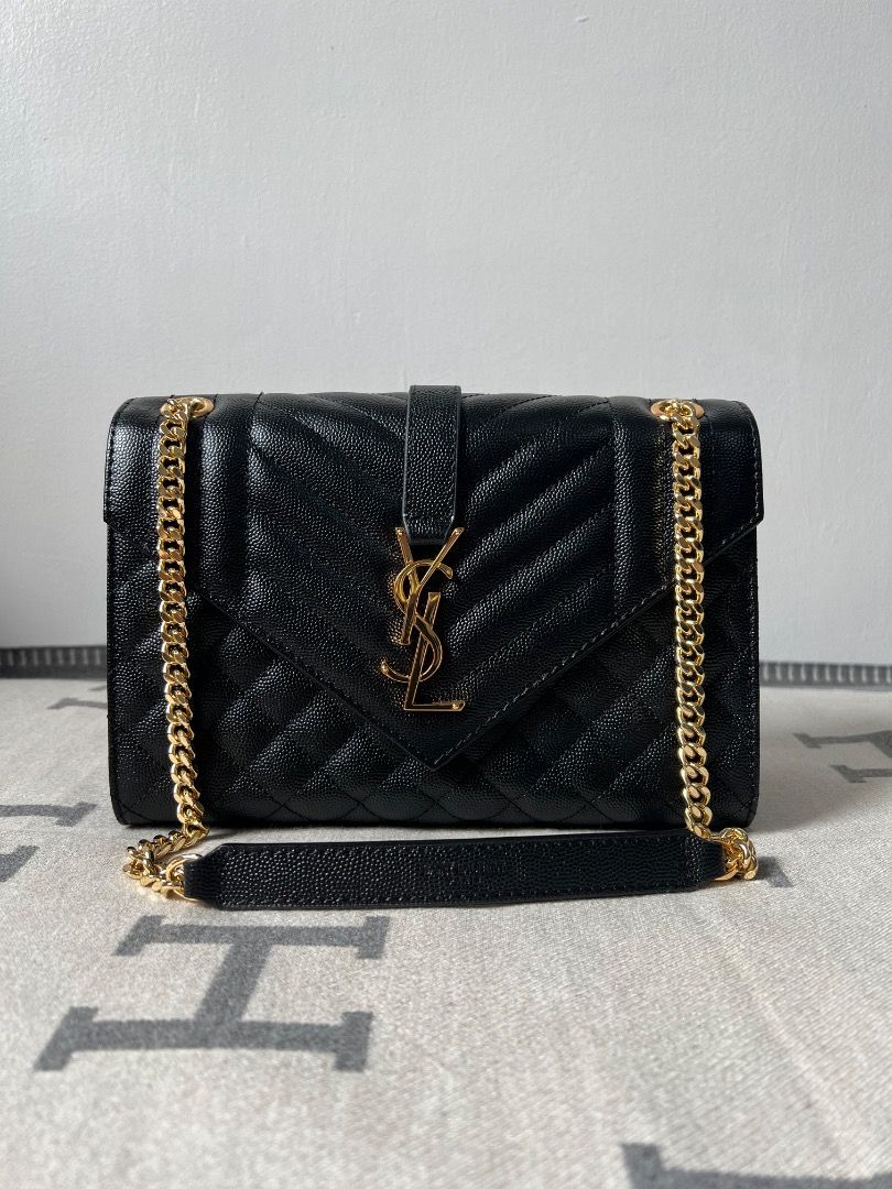 YSL Envelope Medium Quilted Grain Embossed Chain Bag (Category: Luxury Bags & Wallets) located in Antipolo. Submitted by chanchimj (Listing ID 1327355244, Image 1). Description: TIMELESS ENVELOPE FLAP BAG IN GRAIN DE POUDRE EMBOSSED LEATHER, FEATURING CHEVRON AND DIAMOND QUILT OVERSTITCHING. VERSATILE BAG WITH AN ADJUSTABLE SLIDING CHAIN. DIMENSIONS: 9.4 X 6.9 X 2.3 INCHES.
