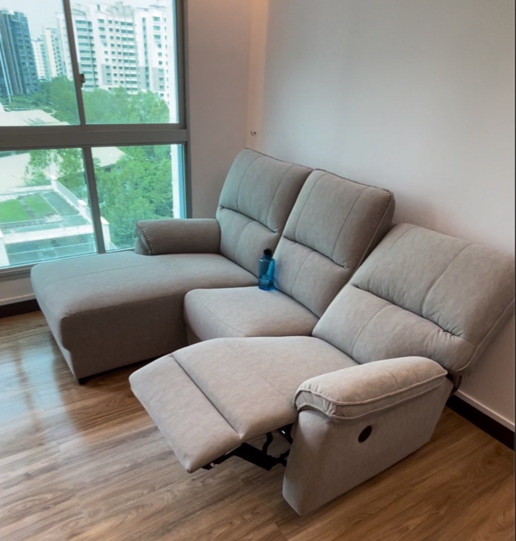 Sofa (Category: Sofas) located in Singapore. Submitted by carousia (Listing ID 1343082113, Image 1). Description: Description for Carousell Listing: “🚨 Modern Recliner Sofa with Chaise for Sale 🚨 ✅ Condition: Excellent, gently used ✅ Features: • Spacious L-shaped design with a comfortable chaise lounge • Recliner function for ultimate relaxation • Soft, durable fabric in neutral grey to complement any decor ✅ Size: Perfect for living rooms of a