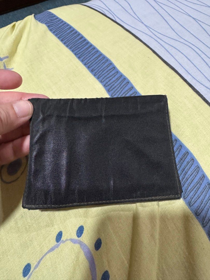💯preloved Prada cardholder (Category: Luxury Bags & Wallets) located in Quezon City. Submitted by KK_declutterluxx (Listing ID 1343045306, Image 3). Description: Authentic Prada nylon cardholder -preloved -creases sa mismong nylon so bawal maarte - overall okay Sf c/o ng buyers .