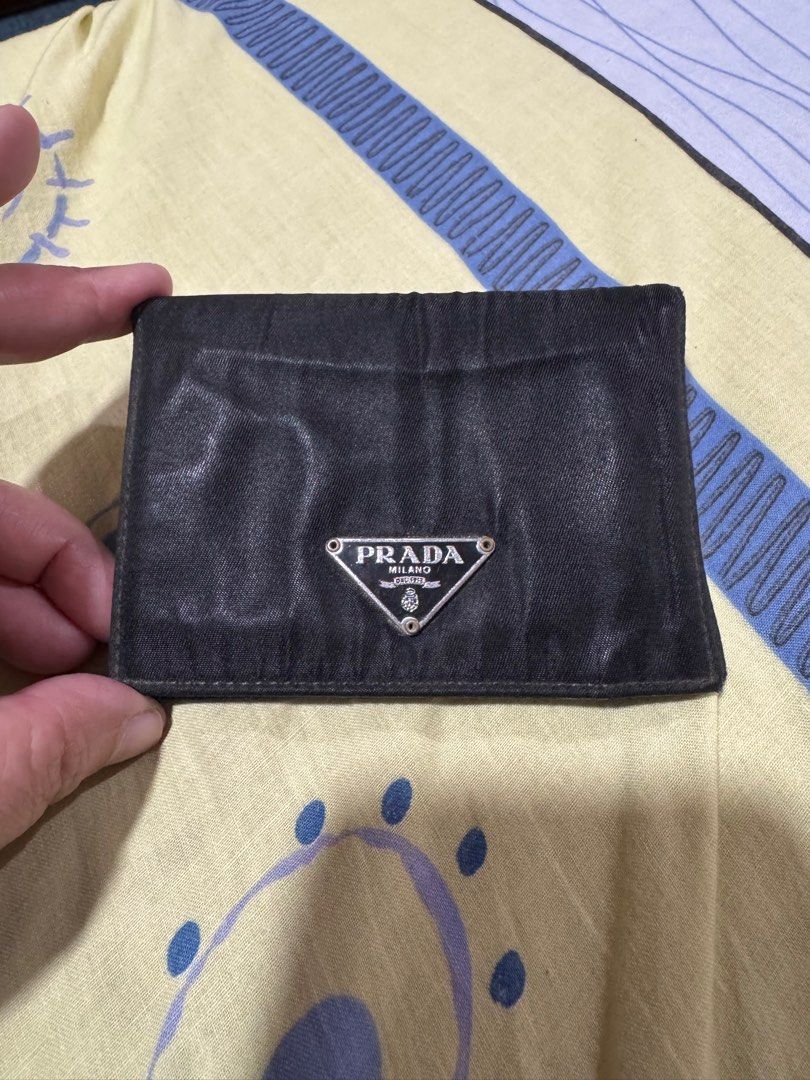 💯preloved Prada cardholder (Category: Luxury Bags & Wallets) located in Quezon City. Submitted by KK_declutterluxx (Listing ID 1343045306, Image 2). Description: Authentic Prada nylon cardholder -preloved -creases sa mismong nylon so bawal maarte - overall okay Sf c/o ng buyers .