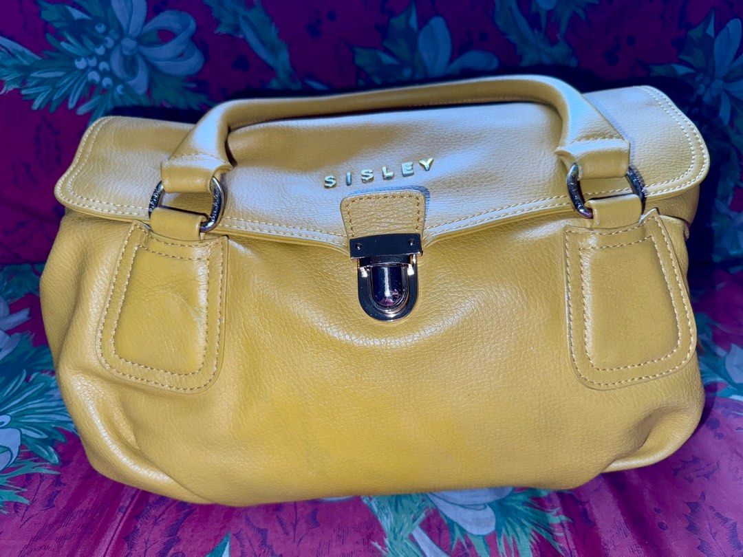 ‼️ORIGINAL : Sisley Hand/Shoulder Bag‼️ (Category: Tote Bags) located in Pasig City. Submitted by catch.your.style (Listing ID 1343038368, Image 1). Description: ❣️Original SISLEY. ❣️Yellow in color with discoloration and a bit crack on leather at the back. As highlighted in the photo. ❣️Large capacity..