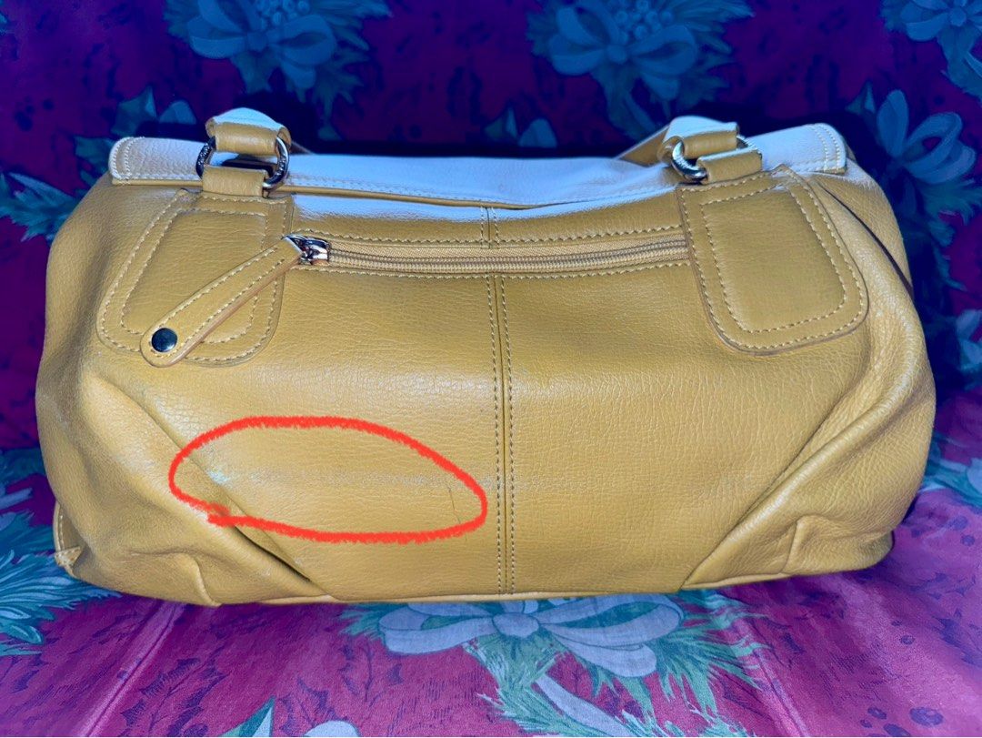‼️ORIGINAL : Sisley Hand/Shoulder Bag‼️ (Category: Tote Bags) located in Pasig City. Submitted by catch.your.style (Listing ID 1343038368, Image 3). Description: ❣️Original SISLEY. ❣️Yellow in color with discoloration and a bit crack on leather at the back. As highlighted in the photo. ❣️Large capacity..