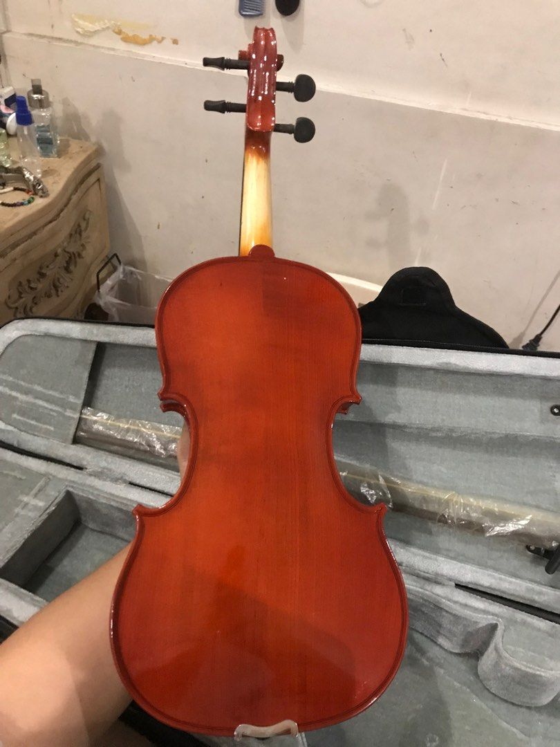 Suzuki 4/4 Violin (Category: Musical Instruments) located in Quezon City. Submitted by e_sol902469 (Listing ID 1343098687, Image 2). Description: This was my own student violin I used about 8 years ago when I picked up the passion for another stringed instrument. Unfortunately I don't use it anymore and would like someone to use it better than I could. Originally bought in Kuwait. Includes: - horse hair bow - rosin - hard case Issues: - tape resi