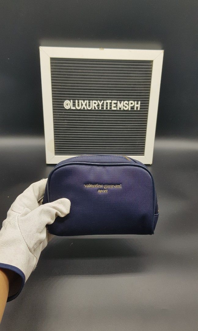 Valentino Garavani pouch (Category: Luxury Bags & Wallets) located in Pamplona. Submitted by luxuryitems_ph (Listing ID 1343041219, Image 1). Description: In good condition(clean interior/some bubbles) no inclusion..