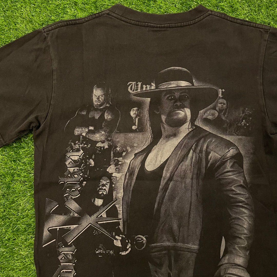 Vintage Boot WWE Undertaker Solo Shirt (Category: Shirts) located in Quezon City. Submitted by emporium.vtg (Listing ID 1343090412, Image 2). Description: Vintage Boot World Wrestling Entertainment Undertaker Solo Back to Back Mega Print Black Shirt Thunder Tag / Single Stitch Neck Size Medium Dimensions: 18”x25” Great condition.