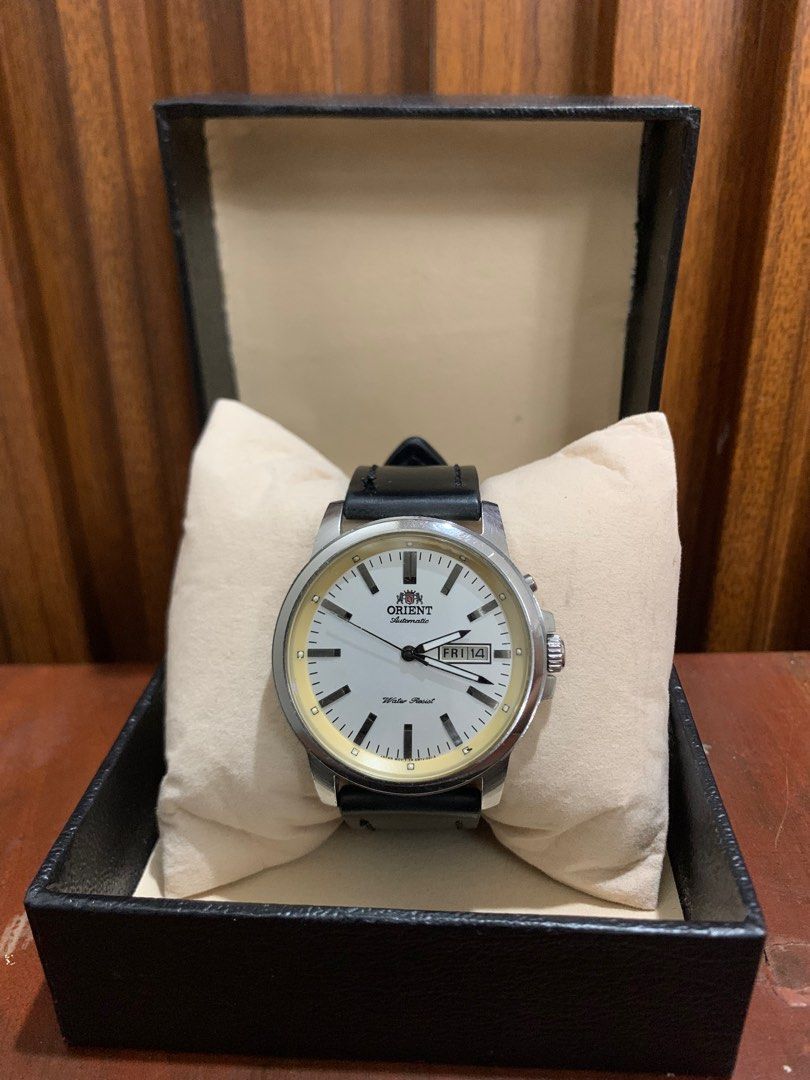 Vintage Orient Watch - Automatic Day-Date - White Dial (Category: Men's Watches) located in Dasmarinas. Submitted by phamhannii (Listing ID 1343097250, Image 1). Description: Vintage Orient Automatic Watch EM7J-C4-A 41mm Day-Date White Dial Leather Strap (Aftermarket) Excellent Running Condition Water Resist Comes w/ free replacement box Dial Condition: 8.5/10 (yellowing and minimal chip on the edges) Overall Condition: 9.2/10 Great Condition Neg