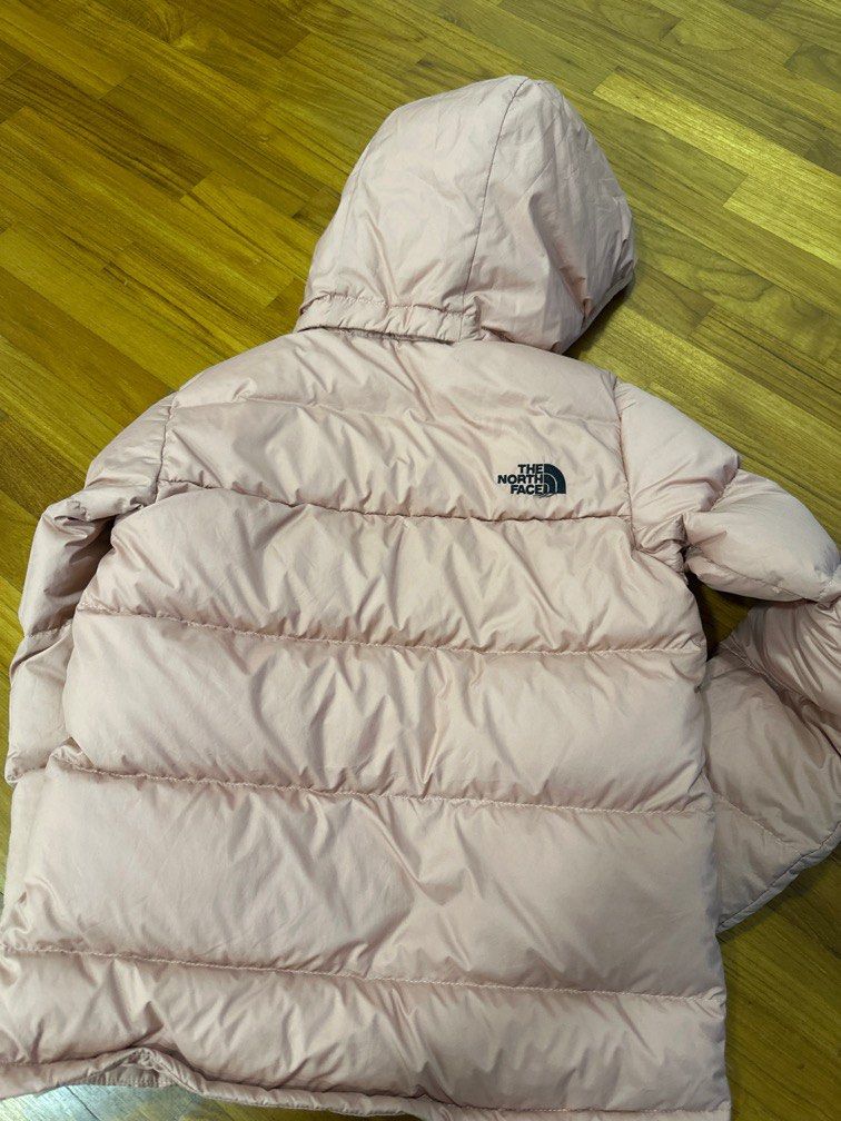 Winter Jacket (Category: Babies & Kids Fashion) located in Singapore. Submitted by egglazy (Listing ID 1343052230, Image 3). Description: The North Face winter down jacket. Size S. Baby pink color. Shell is 100% polyester, filling for body, sleeves and hood is 75% down feathers, 25% waterfowl feathers. Power 550. Suitable for sub zero to less than 15 degrees. Retail price $350. Worn once. Can be machine wash in a cloth bag and to be air dried onl
