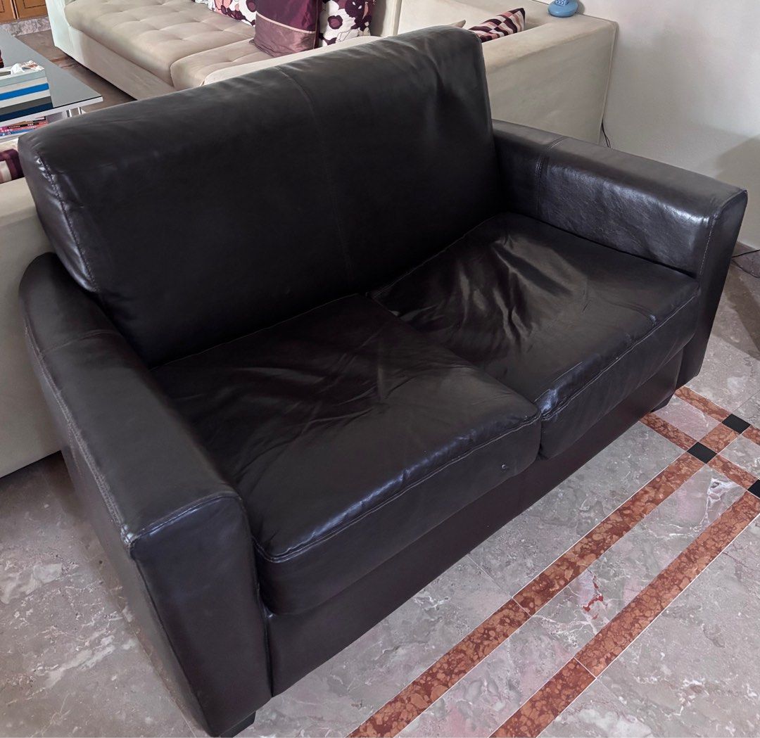 Black Sofa (Category: Sofas) located in Singapore. Submitted by shoppppwithme (Listing ID 1343217813, Image 1). Description: Black Sofa With Minor defect at the right bottom (pls see picture), can be easily patched back 140x80x84cm QYOP, will be clearing in 2 days. Pls arrange your own transportation..