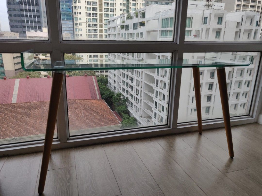 Glass Table (Category: Tables & Sets) located in Makati City. Submitted by omoronph (Listing ID 1343217607, Image 1). Description: - Glass table for decoration - Can work like a TV stand - Purchased from SM, 5999 -Size: 47.5inch x 16inch.