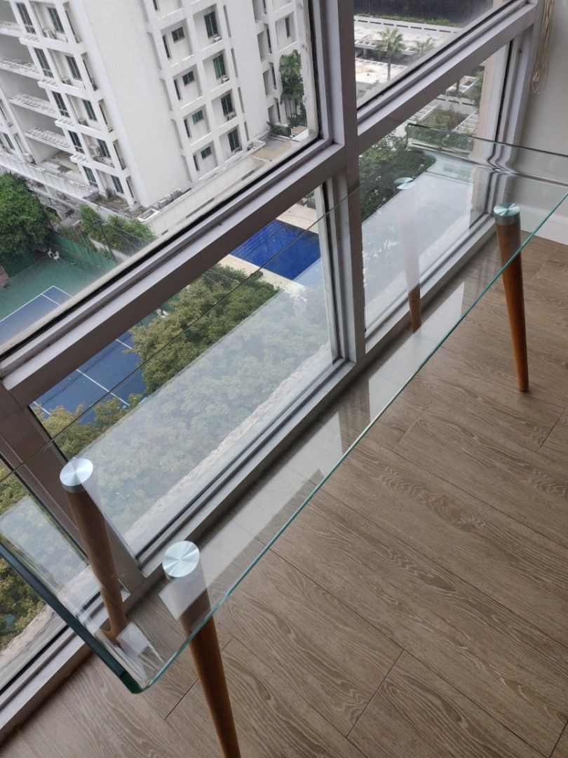 Glass Table (Category: Tables & Sets) located in Makati City. Submitted by omoronph (Listing ID 1343217607, Image 2). Description: - Glass table for decoration - Can work like a TV stand - Purchased from SM, 5999 -Size: 47.5inch x 16inch.