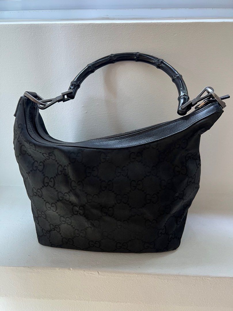 Gucci sling bag (Category: Bags & Wallets) located in Singapore. Submitted by patlph (Listing ID 1343317922, Image 1). Description: The bamboo handle has this metal pin that came off. I have the pin but you need to get someone to fix it. Condition is good otherwise. Rarely used.