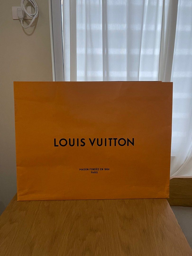 Louis Vuitton original paper bag (Category: Luxury Bags & Wallets) located in Manila. Submitted by lessismore_9x (Listing ID 1343248734, Image 2). Description: This is an original paper bag from Louis Vuitton, available in various sizes. The price may differ based on the size of the paper bag. It is brand new and has never been used, remaining in pristine condition. Price range: 500 - 3,000pesos depending on size and design. For more details, ple