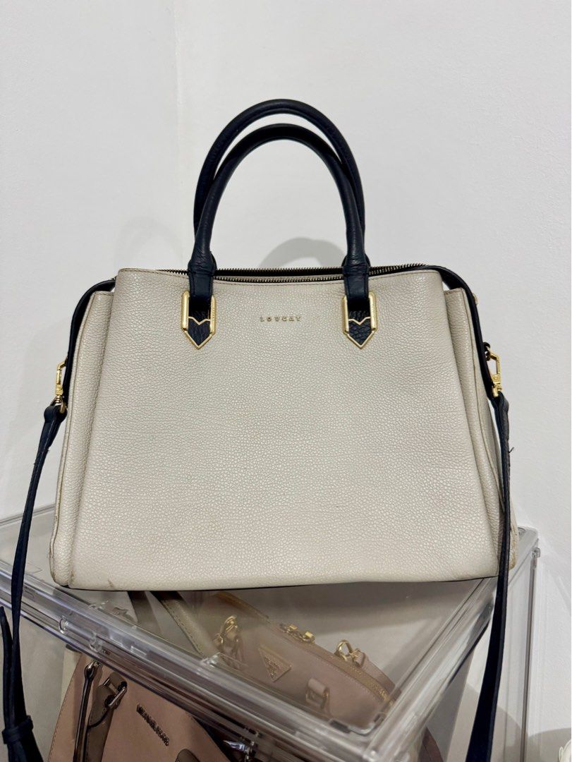 Lovcat Offwhite and Black Two Way Bag (Category: Cross-body Bags) located in Mexico. Submitted by studioleraph (Listing ID 1343304617, Image 1). Description: Pre loved Please manage your expectations 🩷.