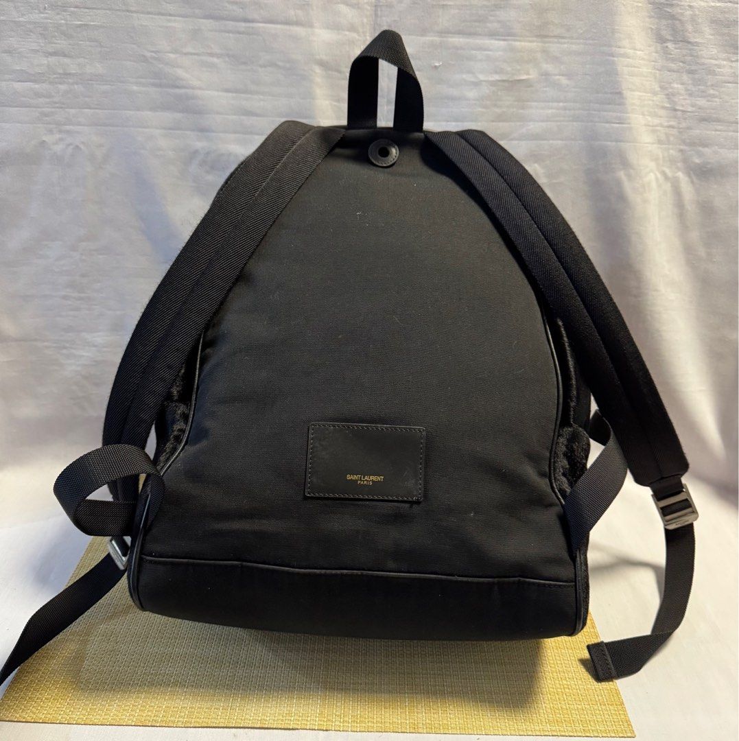 SAINT LAURENT Black Animal Fur Backpack (Category: Luxury Bags & Wallets) located in Baguio. Submitted by pwz-eshop (Listing ID 1343255438, Image 3). Description: • I do not reserve items. I only mark items as reserved when it is paid. Paid items are shipped the next day. No shipping on holidays. • I do not have when worn pictures, please rely on actual dimensions for sizing. • Up for Grabs!! • Flaws: Minor dirt marks on lining. Detached lining a