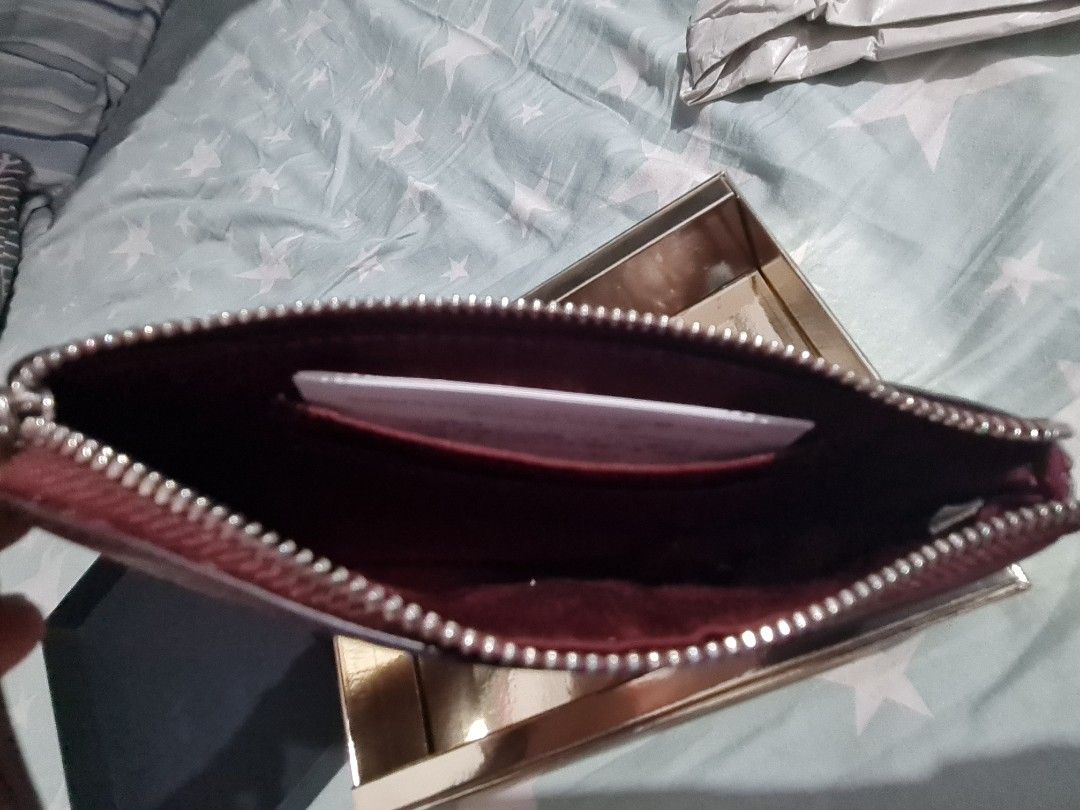 Coach Burgundy glitter wristlet (Category: Wallets & Card holders) located in Quezon City. Submitted by takeemall (Listing ID 1343443366, Image 3). Description: Coach burgundy glitter wristlet Brand new Bought in the US. location: UP Diliman LFS: bought on impulse.