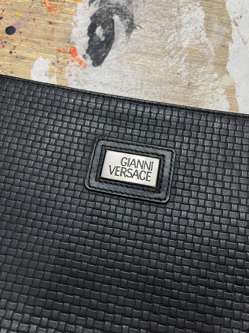Gianni Versace Woven Leather Clutch Bag (Category: Luxury Bags & Wallets) located in Quezon City. Submitted by forgarments (Listing ID 1343500981, Image 2). Description: Gianni Versace Woven Textured Leather Clutch Bag Pristine Condition Width: 10.5 inches Height: 7.5 Inches Depth: 2 Inches Crafted from premium leather, this clutch features an intricate woven pattern on the front and back, reminiscent of the timeless Bottega Veneta design. The YK