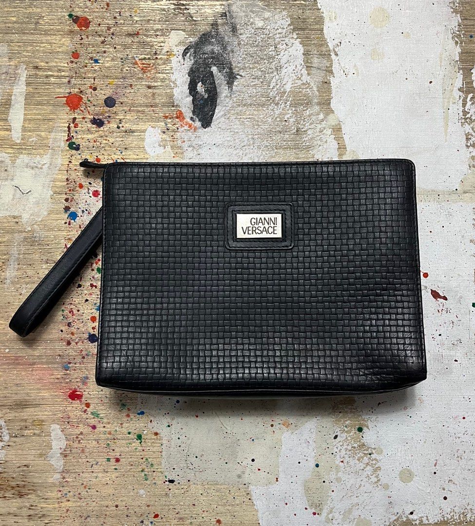 Gianni Versace Woven Leather Clutch Bag (Category: Luxury Bags & Wallets) located in Quezon City. Submitted by forgarments (Listing ID 1343500981, Image 1). Description: Gianni Versace Woven Textured Leather Clutch Bag Pristine Condition Width: 10.5 inches Height: 7.5 Inches Depth: 2 Inches Crafted from premium leather, this clutch features an intricate woven pattern on the front and back, reminiscent of the timeless Bottega Veneta design. The YK