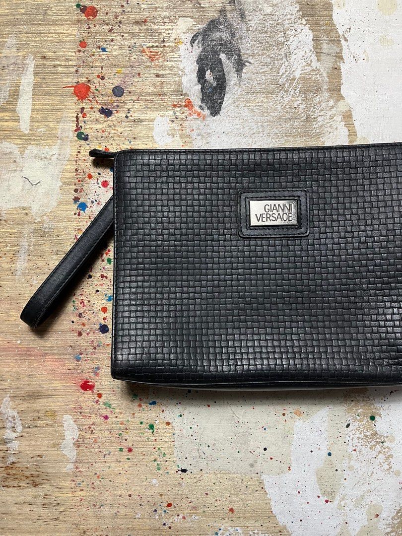 Gianni Versace Woven Leather Clutch Bag (Category: Luxury Bags & Wallets) located in Quezon City. Submitted by forgarments (Listing ID 1343500981, Image 3). Description: Gianni Versace Woven Textured Leather Clutch Bag Pristine Condition Width: 10.5 inches Height: 7.5 Inches Depth: 2 Inches Crafted from premium leather, this clutch features an intricate woven pattern on the front and back, reminiscent of the timeless Bottega Veneta design. The YK