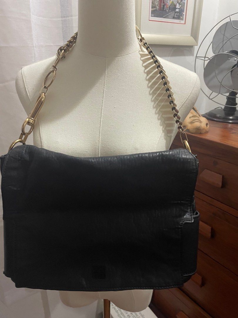 RUSH SALE! GIVENCHY Melanchola Shoulder Bag (Category: Luxury Bags & Wallets) located in Paranaque City. Submitted by elegantlycheap (Listing ID 1343491799, Image 2). Description: Very Nice leather No rubs nor any cracks on the leather Please SELF AUTHENTICATE CODED With generic dust bag .