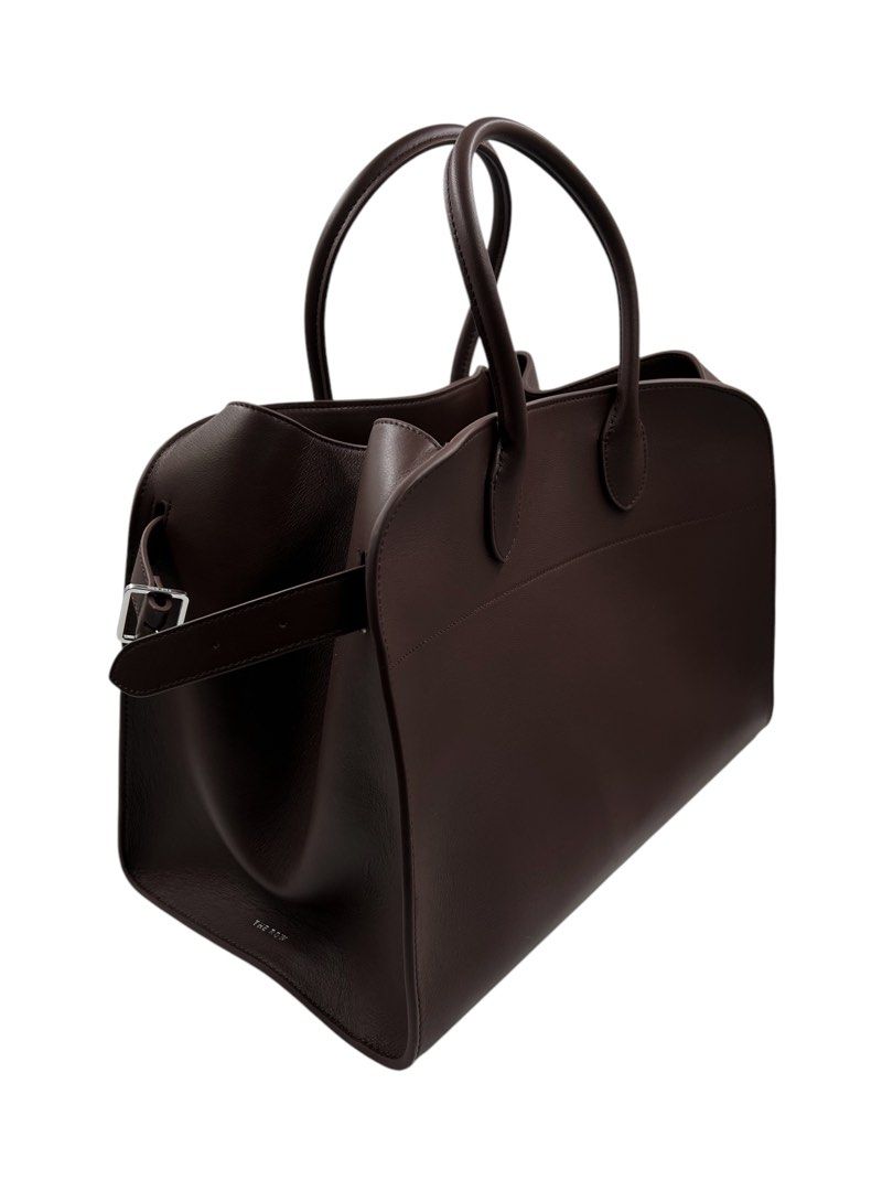 ⚜️The Row 17 - Dark Brown bag (Category: Luxury Bags & Wallets) located in Makati City. Submitted by 90sangel (Listing ID 1343423833, Image 3). Description: •Item: The Row 17 - Dark brown bag 👜🤎 Your new Birkin... 📈👜 hard to get & find •Size: 17 Large & big (we have size 15) •Condition: Brand New Condition *Softly structured top-handle bag in soft dark brown leather with belted gusseted side panels and interior toggle closure.👜⚜️ Guaranteed 