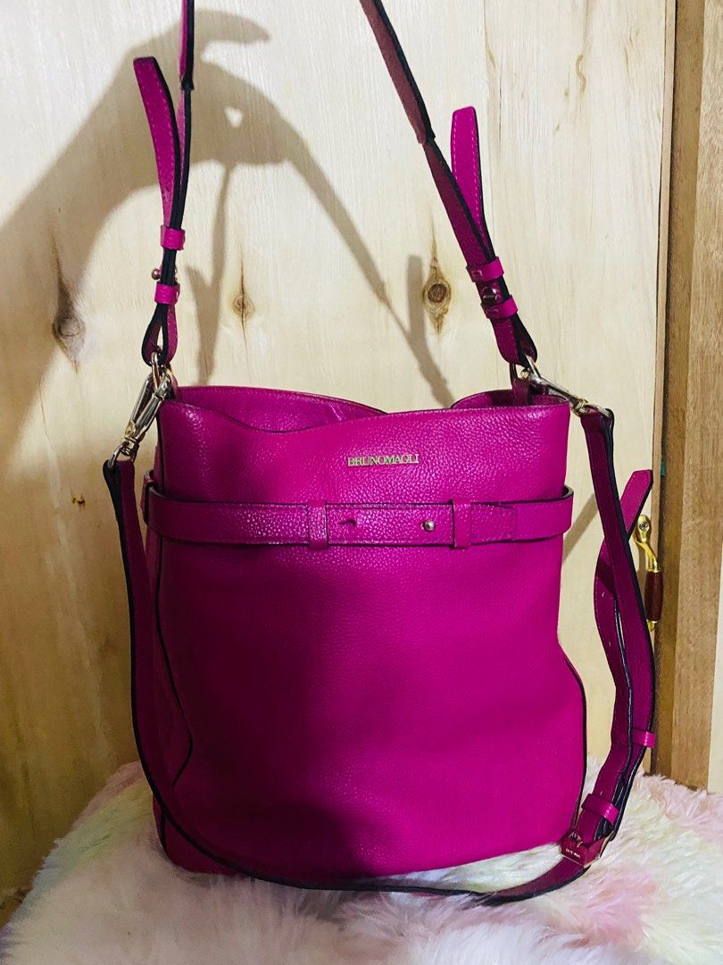 Authentic Bruno Magli (Category: Luxury Bags & Wallets) located in Paranaque City. Submitted by love1927 (Listing ID 1343594608, Image 2). Description: Up for grabs is my Bruno Magli bag in Hot pink made in italy Bought this at Bruno Magli in italy for 400$ This is two way bag In cowhide genuine pebble leather I like this bag but since got many bags i need to let this go Height of the bag is:11 inches Length of the bag:11 inches It has one zip po