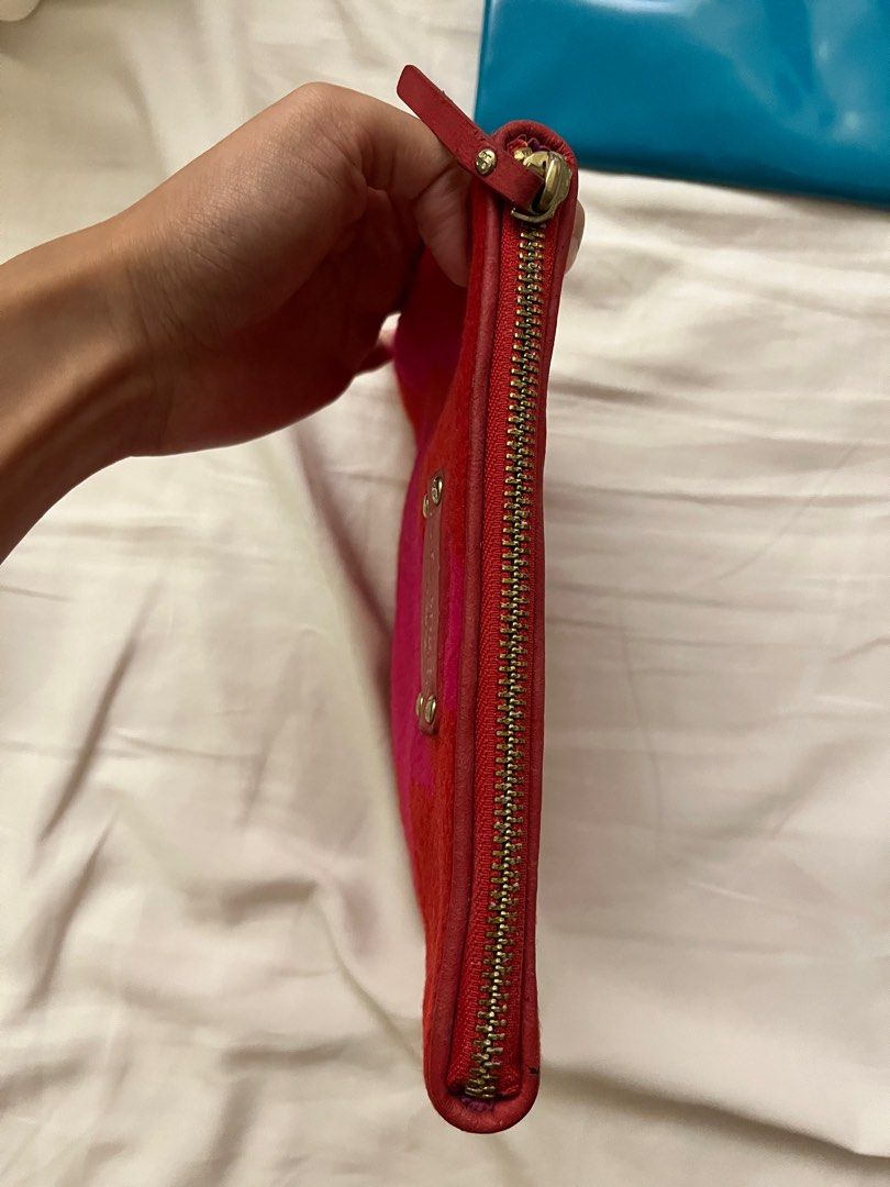 Authentic Kade Spade New York Clutch (Category: Luxury Bags & Wallets) located in Muntinlupa City. Submitted by alsthings (Listing ID 1343660193, Image 2). Description: Great condition! 100% authentic. Only flaw is the faded Kate Spade label as seen on the photo. Can get as bundle with the other Kate Spade pouch for Php2,500..