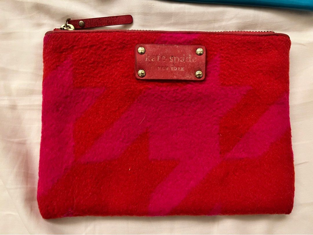 Authentic Kade Spade New York Clutch (Category: Luxury Bags & Wallets) located in Muntinlupa City. Submitted by alsthings (Listing ID 1343660193, Image 1). Description: Great condition! 100% authentic. Only flaw is the faded Kate Spade label as seen on the photo. Can get as bundle with the other Kate Spade pouch for Php2,500..