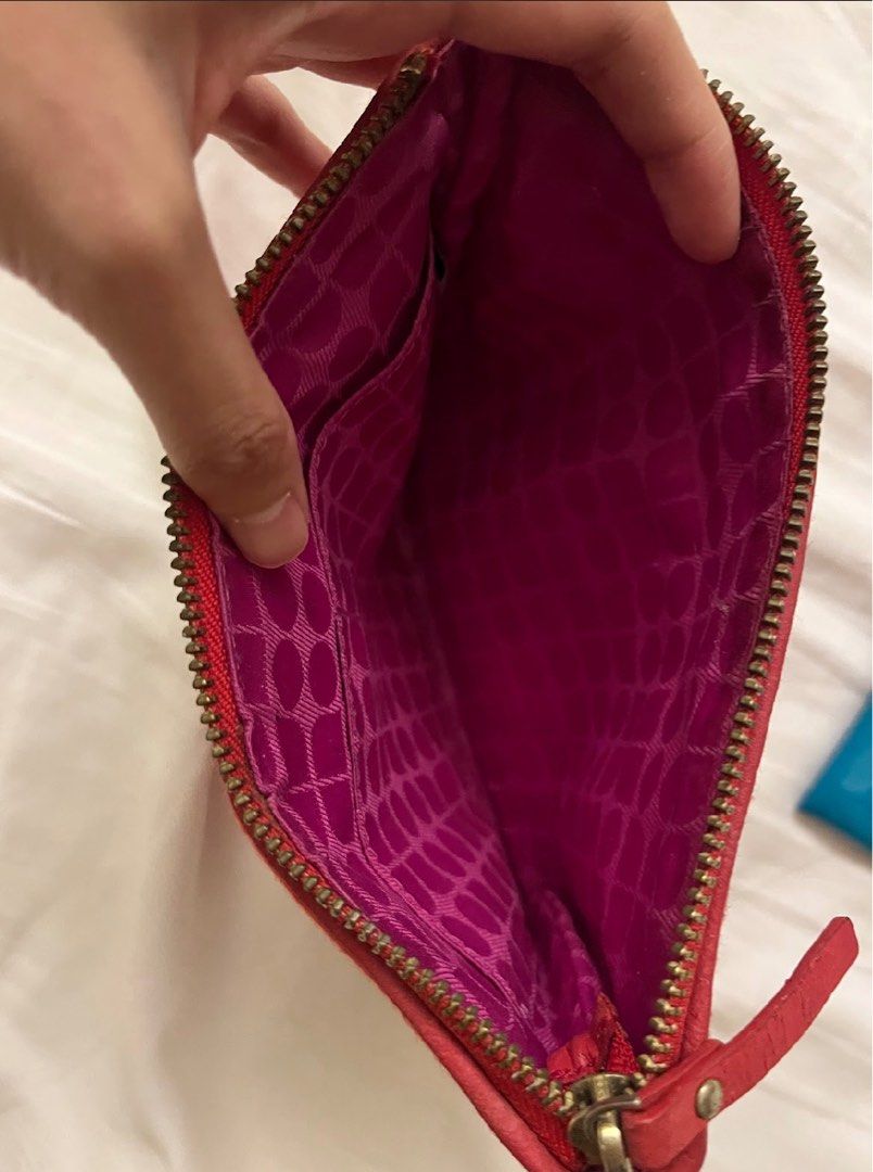 Authentic Kade Spade New York Clutch (Category: Luxury Bags & Wallets) located in Muntinlupa City. Submitted by alsthings (Listing ID 1343660193, Image 3). Description: Great condition! 100% authentic. Only flaw is the faded Kate Spade label as seen on the photo. Can get as bundle with the other Kate Spade pouch for Php2,500..