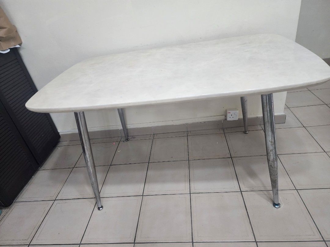 Dining Table (Category: Tables & Sets) located in Singapore. Submitted by AngieL (Listing ID 1343582625, Image 1). Description: Dining table with fabricated marble top. ight scratches on top.L 136cm, H 74 cm, B 80 cm. Self pick up.
