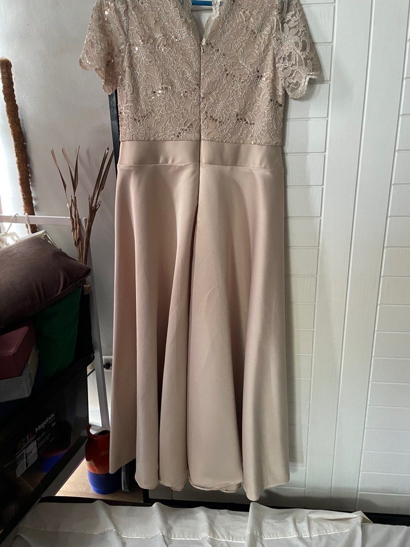 Beige Formal Dress (Category: Evening dresses & gowns) located in Pasig City. Submitted by summermid (Listing ID 1343861588, Image 3). Description: Selling a beautiful gown worn by my mother-in-law for my wedding. It’s perfect got weddings, galas, or other formal occasions. Size: Large on tag (see photos for measurements) Color: Beige Style: A-line, sequined Buyer covers shipping cost. Bought this at SM Department Store for 7k now selling for 3k,