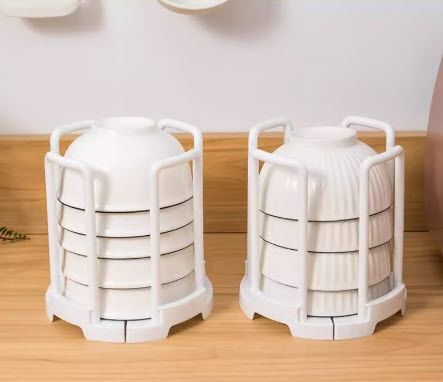 Expandable Drying Bowl Rack Plate holder Kitchen Organizer (Category: Food Organization & Storage) located in Manila. Submitted by classy.home (Listing ID 1343771812, Image 1). Description: Available Color: White Material: PP Plastic Size: - When Folded: Diameter:14 Height:16 (cm) - When Expanded: Diameter:19 Height:16 (cm).