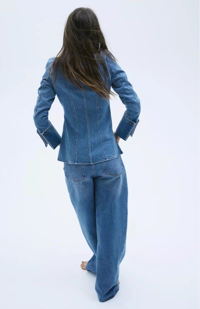 H&M Edition Fitted Denim Shirt (Category: Longsleeves) located in Makati City. Submitted by style.cents (Listing ID 1344036434, Image 3). Description: Fitted shirt in sturdy denim with a pointed collar and buttons down the front. Shaping darts at the front and back, long sleeves and folded, open cuffs with decorative buttons. Straight cut hem with a slit at each side. Shirt can be worn as a jacket Orig price: P3,290 Never worn .