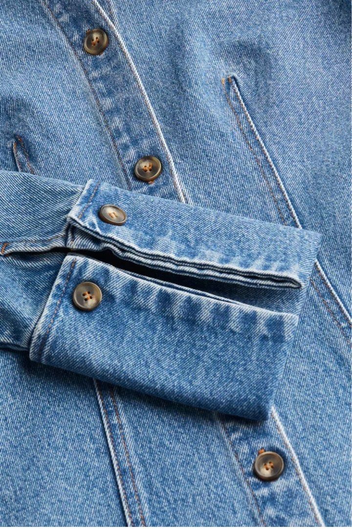 H&M Edition Fitted Denim Shirt (Category: Longsleeves) located in Makati City. Submitted by style.cents (Listing ID 1344036434, Image 2). Description: Fitted shirt in sturdy denim with a pointed collar and buttons down the front. Shaping darts at the front and back, long sleeves and folded, open cuffs with decorative buttons. Straight cut hem with a slit at each side. Shirt can be worn as a jacket Orig price: P3,290 Never worn .
