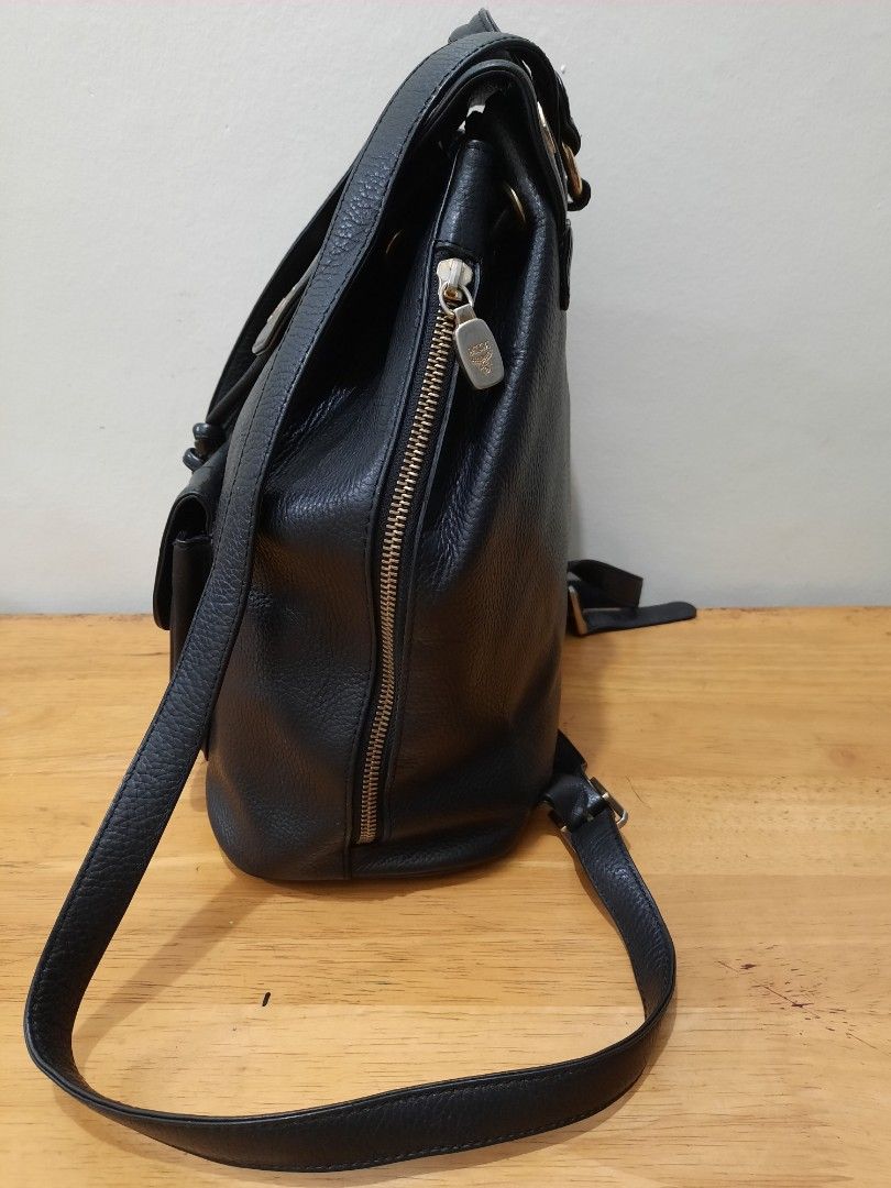 MCM Backpack Leather Germany (Category: Luxury Bags & Wallets) located in Valenzuela. Submitted by one.touch (Listing ID 1344200864, Image 3). Description: 👜MCM BACKPACK 👜BLACK LEATHER w/ GOLD STUDS ✅PRELOVED/USED ✅Good Condition ✅Few tarnish on hardware ✅Very Good Leather Condition ✅Medium size 13x12 inches ✅Draw String Clousure ✅Shoulder Leather Strap ✅Canvass lining 📍Loc: Valenzuela City 🛵Courier: LBC/Lalamove/J&T 💸Payment First 🚫No COD.