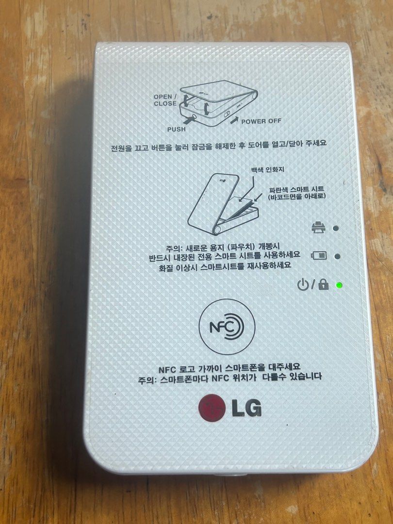 Mini LG photo printer (Category: Cameras) located in Caloocan City. Submitted by guitara1822 (Listing ID 1344067254, Image 2). Description: LG POCKET PHOTO PRINTER PD239 PORTABLE WHITE. Condition is “Used”. Looks like it was never used. Please look at all pictures for the condition. SOLD AS IS NO RETURNS .... Perfect Smartphone and Tablet Companion for Instant Mobile Printing Slimmer Design for Better Portability Resolution - 313 x 600 dpi.