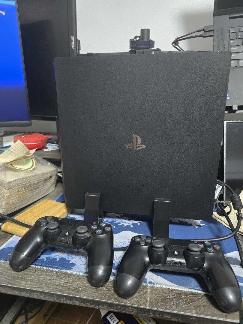 Playstation 4 Pro (Category: PlayStation) located in Taguig. Submitted by orange_potion (Listing ID 1344165620, Image 2). Description: For Sale PS4 Pro With box and accessories Version: CUH-7218B B01 Firmware Version: 11.0 (latest) Storage: 1TB Bundle Inclusions (when Console was purchased): 2x Dualshock 4 Wireless Controllers (both upgraded to Hall Effect 12/14/2024) 1x Ds4 Charging cable 1x Power cord 1x HDMI cable 1x Earpiece 1x The Last Of Us