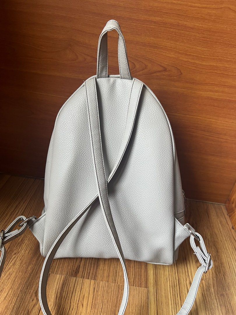 Guess mini leather backpack- Grey (Category: Backpacks) located in Manila. Submitted by shopstop_declutter (Listing ID 1344309469, Image 2). Description: ❀minor defects-zipper slightly threading (see last picture) ❀rfs: declutterring ❀edit: rush sale! can give for 800 ❀mop: bank transfer or gcash.