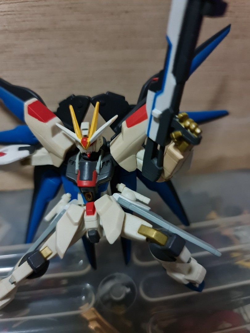 Strike Freedom Gundam Figurine (Category: Gundam Model Kits) located in Singapore. Submitted by xzzz30 (Listing ID 1344372843, Image 2). Description: Gundam action figure, has yellowing on some parts of the arms and shoulder pad.