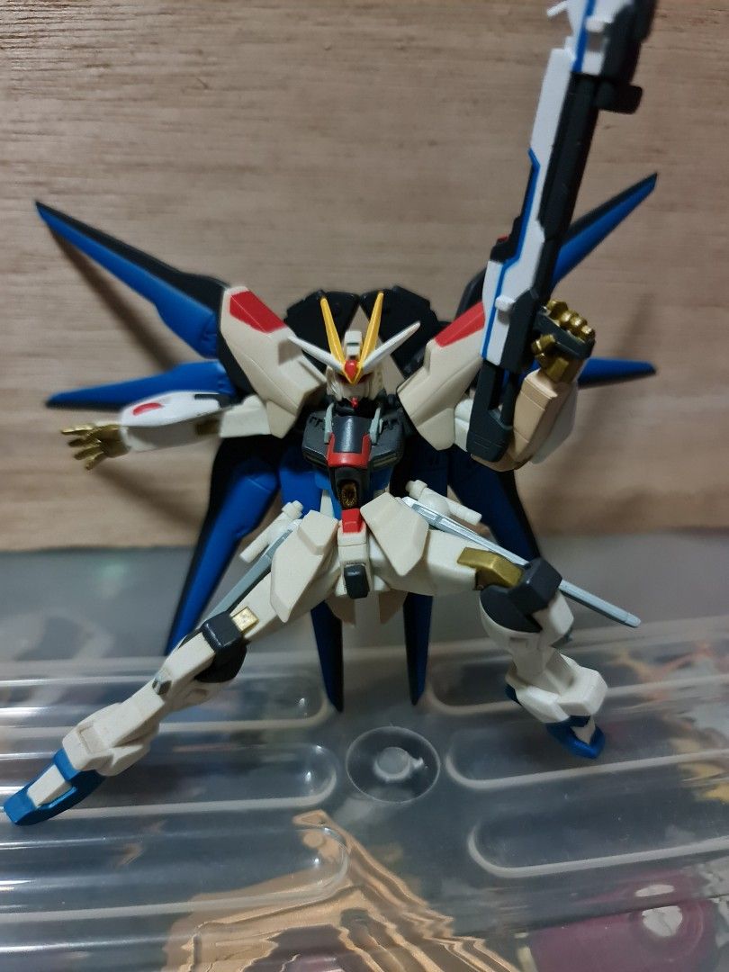 Strike Freedom Gundam Figurine (Category: Gundam Model Kits) located in Singapore. Submitted by xzzz30 (Listing ID 1344372843, Image 1). Description: Gundam action figure, has yellowing on some parts of the arms and shoulder pad.