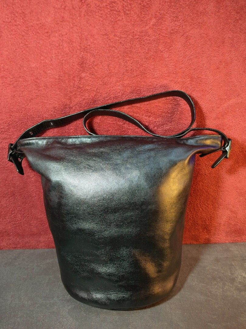 Vintage Coach Bucket Hobo Leather Bag (Category: Luxury Bags & Wallets) located in Malabon City. Submitted by sartorial_finds (Listing ID 1344404331, Image 1). Description: Dimensions:13" H x 16"/9"L x7"W, large bucket bag. Materials: Genuine Cowhide Leather in Black, Cotton Nylon Interior with Hologram, Brass and Black Hardware, YKK Zippers. Condition: 8.5-9/10, good to very good vintage bag. Tarnishes on the hardware, the rose gold brass hardwa