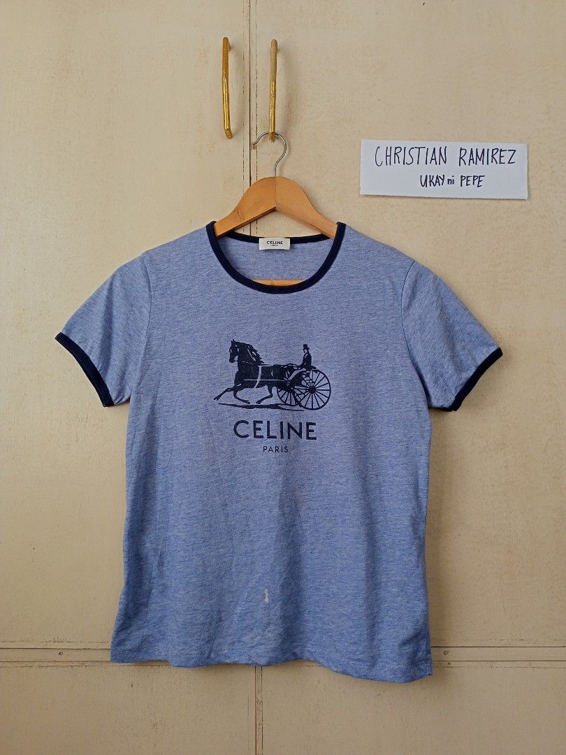 Celine Paris horse tee (Category: Luxury Apparel) located in Bocaue. Submitted by ukaynipepe (Listing ID 1339595465, Image 1). Description: for sale Celine Paris horse tee Heather blue colorway searchable code✔️ medium on tag Width 18 Length 22.5 issue bleach stain and washable stain (see last 2 pics) still in good condition 📩.